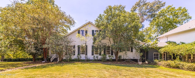 view of front of property with a front lawn