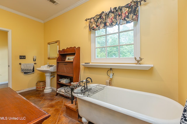 bathroom featuring crown molding, a tub, sink, and tile patterned flooring