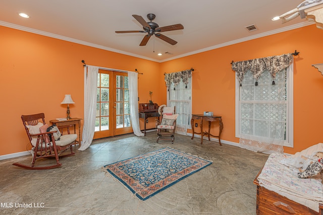 sitting room with french doors, ceiling fan, and crown molding