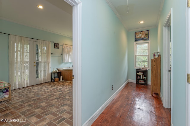 hall featuring french doors, ornamental molding, and dark hardwood / wood-style floors