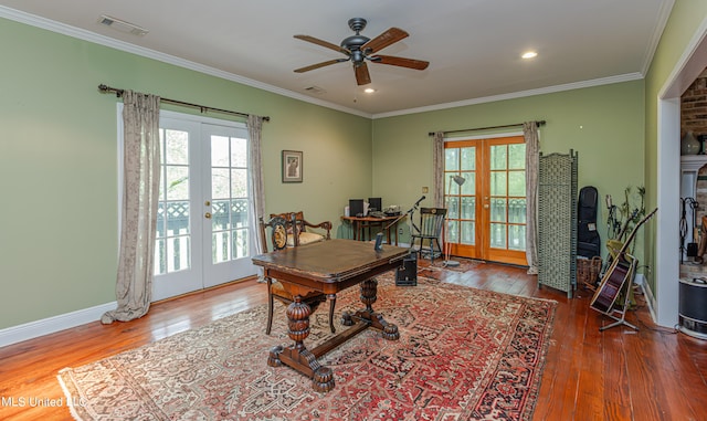 home office featuring a wealth of natural light, french doors, and hardwood / wood-style flooring