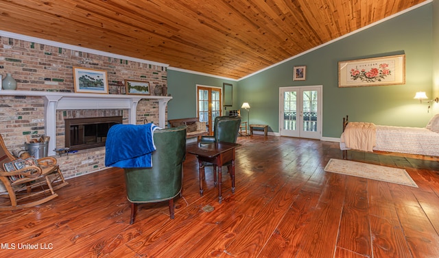 living room featuring lofted ceiling, wooden ceiling, wood-type flooring, a brick fireplace, and french doors