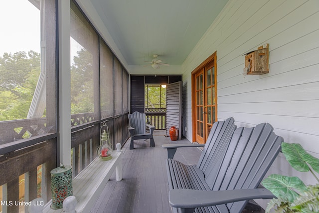 sunroom / solarium featuring ceiling fan