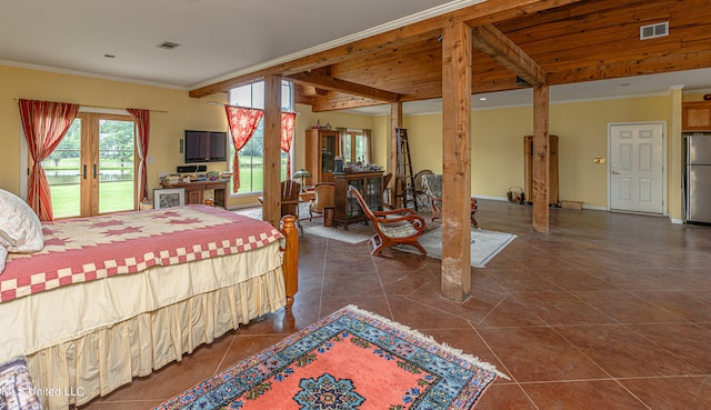 bedroom featuring stainless steel fridge, access to outside, dark tile patterned floors, crown molding, and french doors