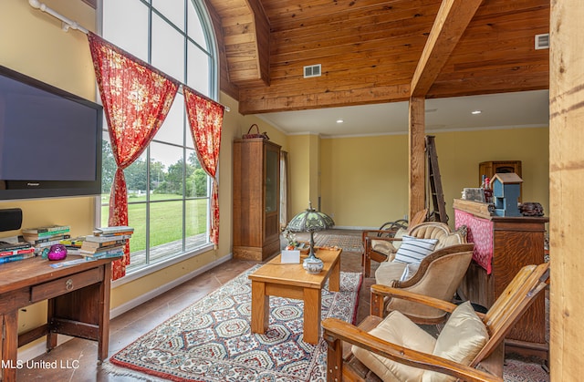 living area with crown molding, lofted ceiling with beams, light tile patterned floors, and wooden ceiling