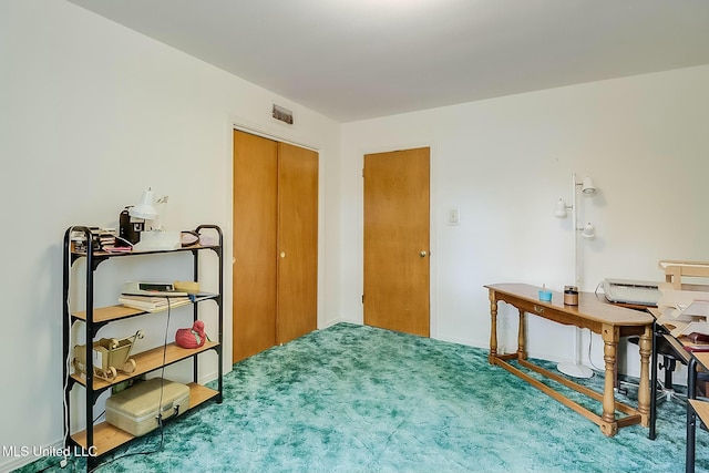 carpeted bedroom featuring a closet