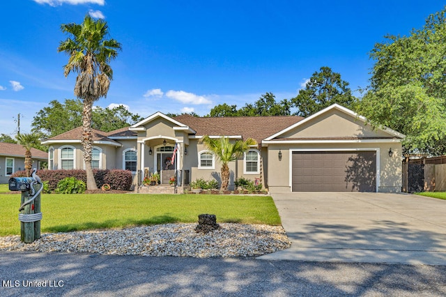 ranch-style home with a front yard and a garage