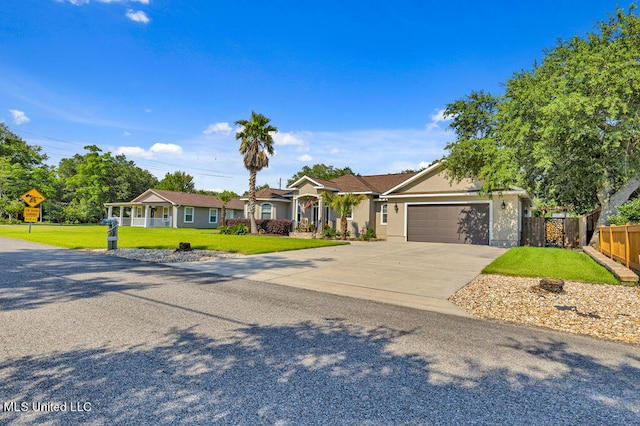 single story home with a front yard and a garage