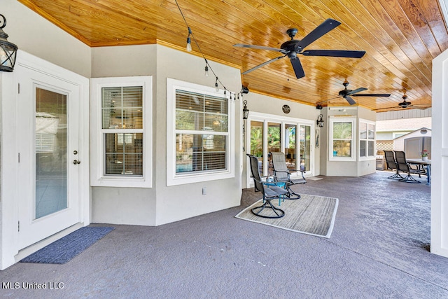 view of patio featuring ceiling fan