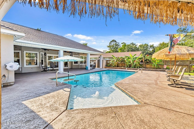 view of pool with a patio area and ceiling fan