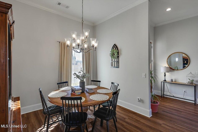 dining room featuring a chandelier, dark hardwood / wood-style flooring, and crown molding