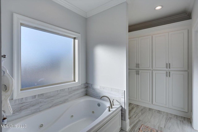 bathroom featuring a washtub and crown molding