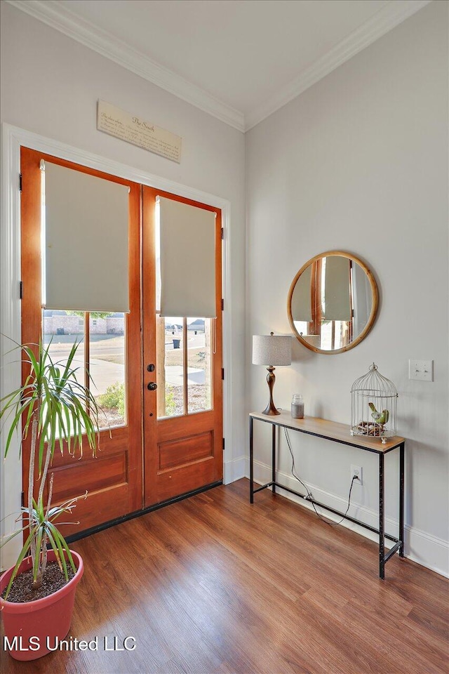 foyer featuring crown molding, french doors, and wood-type flooring