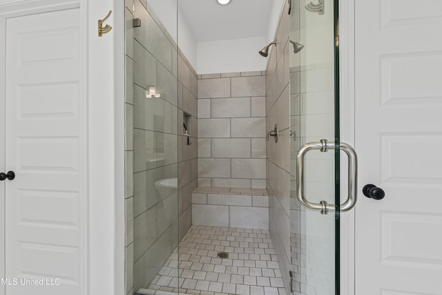 bathroom featuring a shower stall