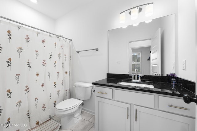 full bath featuring vanity, baseboards, curtained shower, tile patterned flooring, and toilet