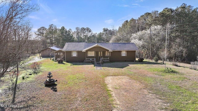 1810 Dry Creek Rd, Magee, MS 39111 - ranch-style home with a forest view and a front lawn