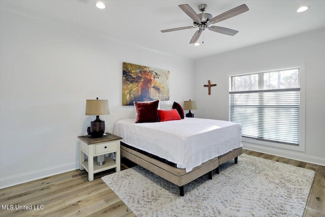 bedroom featuring ceiling fan and light wood-type flooring