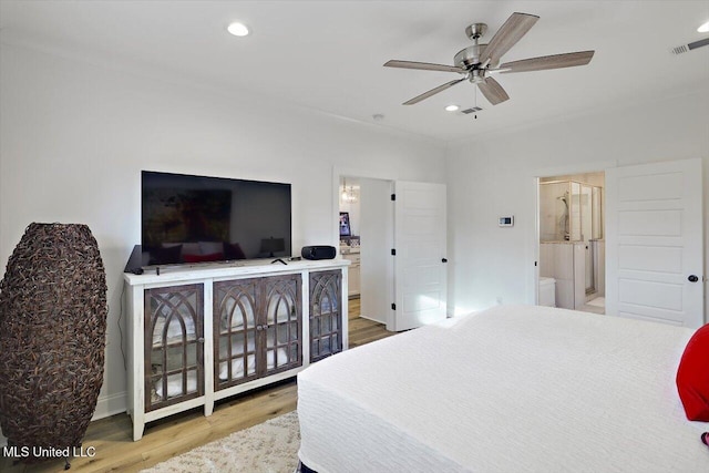 bedroom featuring ensuite bathroom, ceiling fan, and light hardwood / wood-style floors