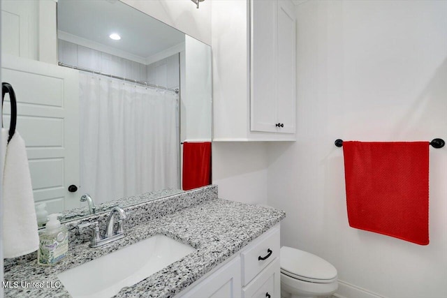 bathroom with toilet and vanity