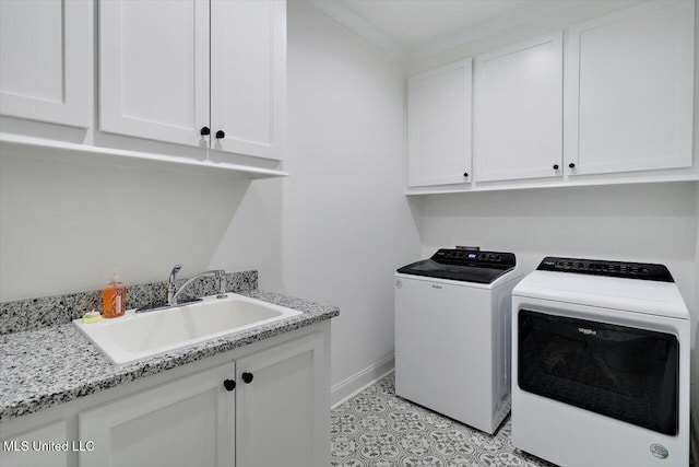 clothes washing area featuring independent washer and dryer, cabinets, light tile patterned floors, and sink