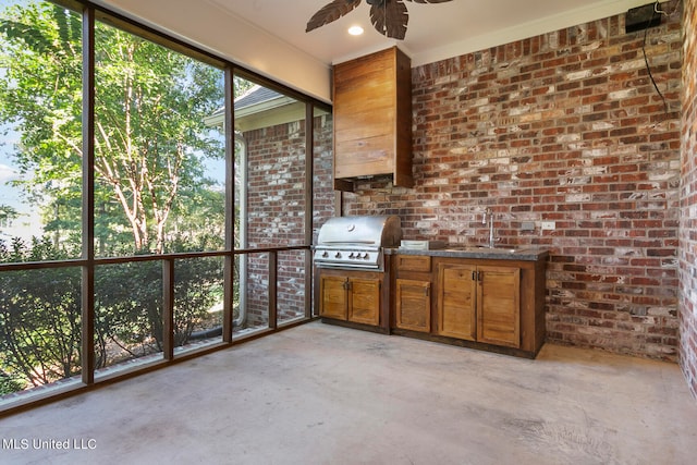 unfurnished sunroom with sink and ceiling fan