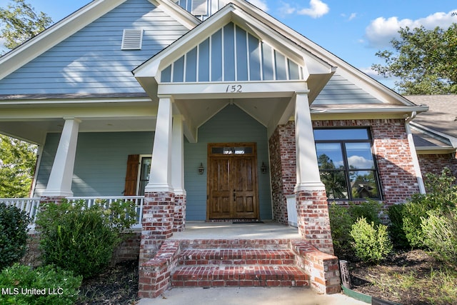 property entrance with covered porch