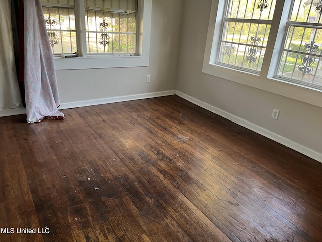 2115 Powers Ave, Jackson, MS 39213 - spare room with dark wood-style floors and plenty of natural light