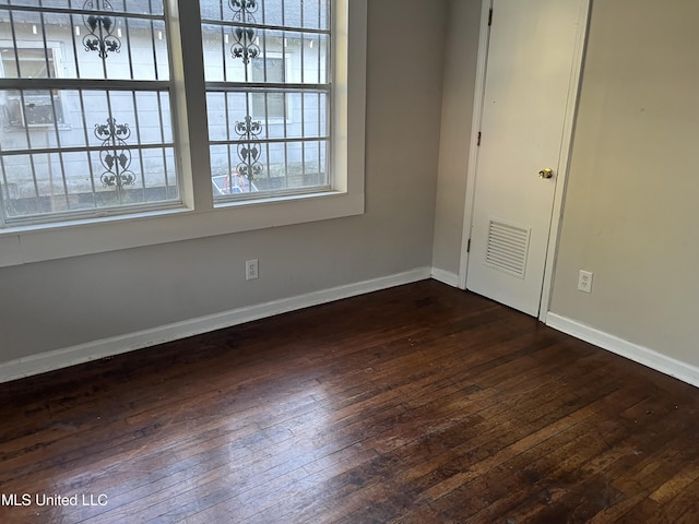 2115 Powers Ave, Jackson, MS 39213 - spare room featuring dark wood-style floors and baseboards