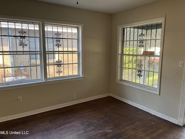 2115 Powers Ave, Jackson, MS 39213 - spare room with dark wood-style floors and healthy amount of natural light