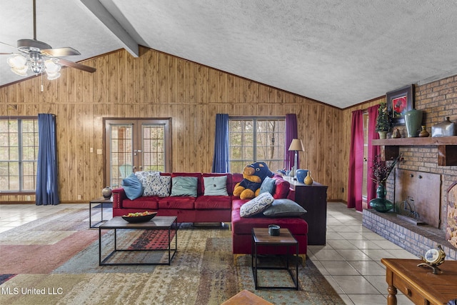 tiled living room with vaulted ceiling with beams, a fireplace, a wealth of natural light, and wooden walls