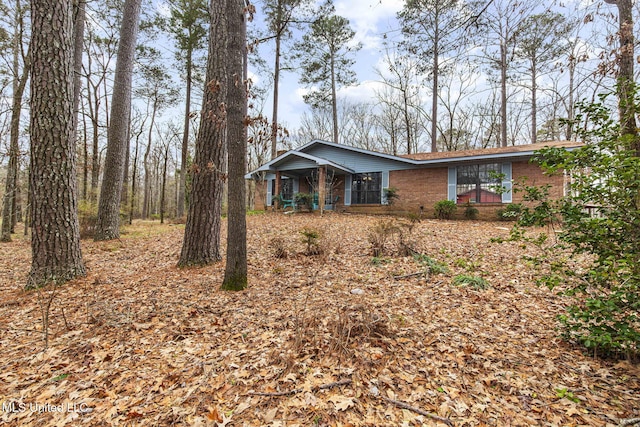 view of front of house with brick siding