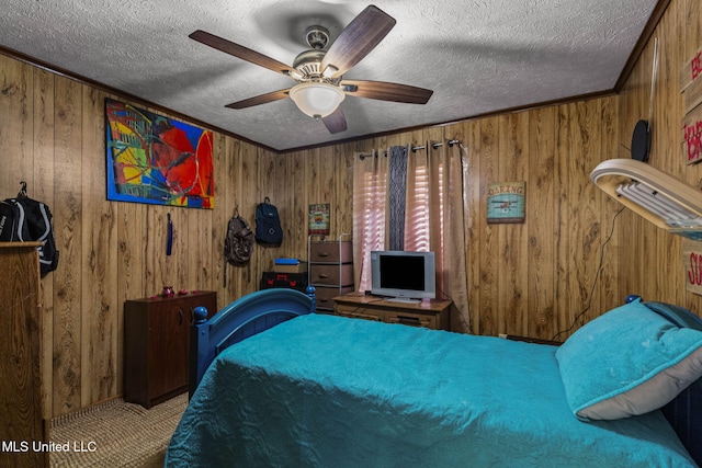 bedroom featuring carpet flooring, crown molding, a textured ceiling, and ceiling fan