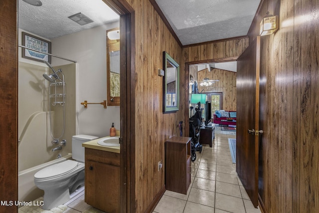 bathroom featuring visible vents, toilet, wood walls, a textured ceiling, and vanity