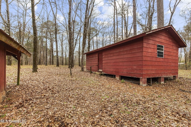 view of home's exterior with an outdoor structure