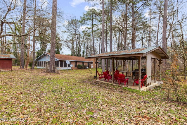 view of yard featuring a gazebo and an outdoor structure