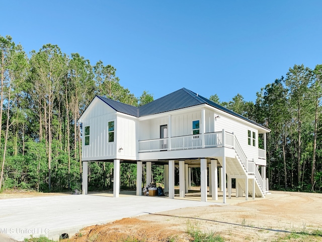 back of property with a carport