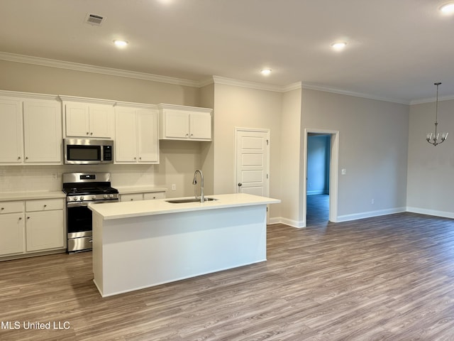 kitchen with a center island with sink, light hardwood / wood-style floors, white cabinets, and stainless steel appliances