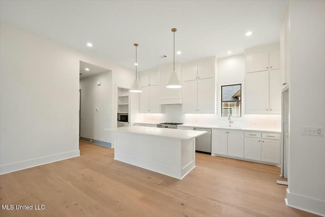 kitchen with backsplash, stainless steel dishwasher, white cabinetry, and light wood-type flooring