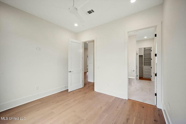unfurnished bedroom featuring light wood finished floors, baseboards, visible vents, and recessed lighting