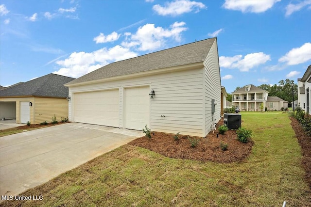 garage featuring central AC and driveway
