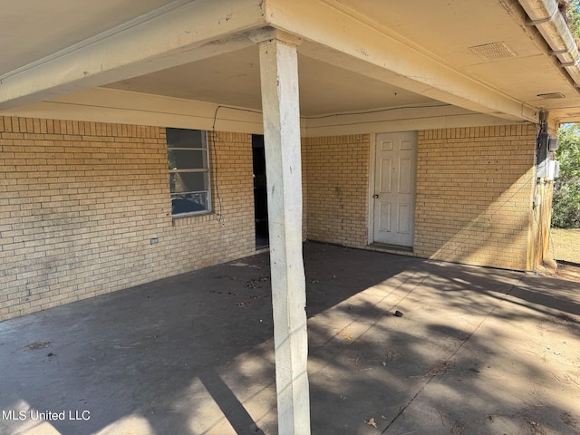 306 Hillcrest St, Carthage, MS 39051 - view of patio featuring a carport