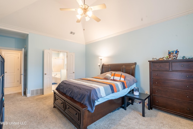 carpeted bedroom featuring ornamental molding, vaulted ceiling, ensuite bathroom, and ceiling fan