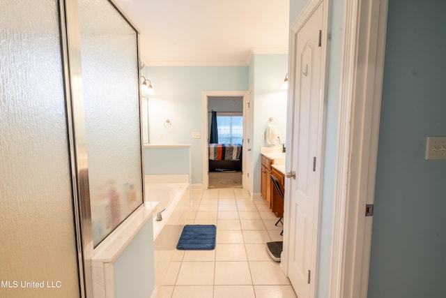 bathroom featuring vanity, crown molding, tile patterned floors, and a washtub