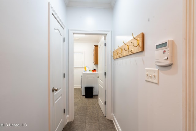 890 Lindsey Cv, Hernando, MS 38632 - corridor with ornamental molding, dark tile patterned flooring, and washer / dryer