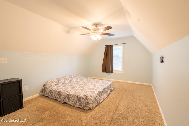 bedroom with vaulted ceiling, carpet floors, and ceiling fan