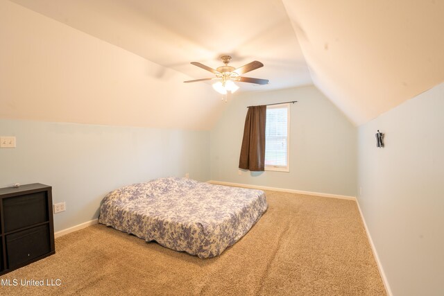 890 Lindsey Cv, Hernando, MS 38632 - carpeted bedroom featuring lofted ceiling, baseboards, and a ceiling fan