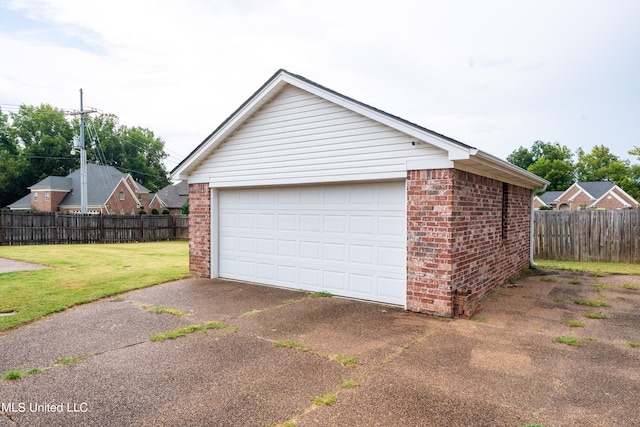 garage with a yard