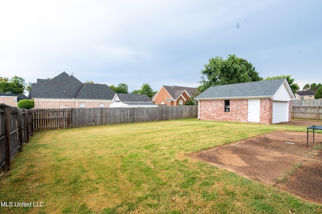 890 Lindsey Cv, Hernando, MS 38632 - view of yard with a garage and an outbuilding