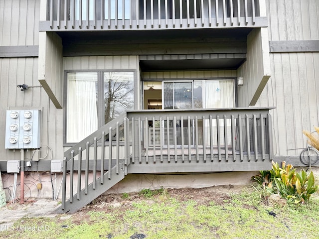 view of exterior entry featuring a balcony