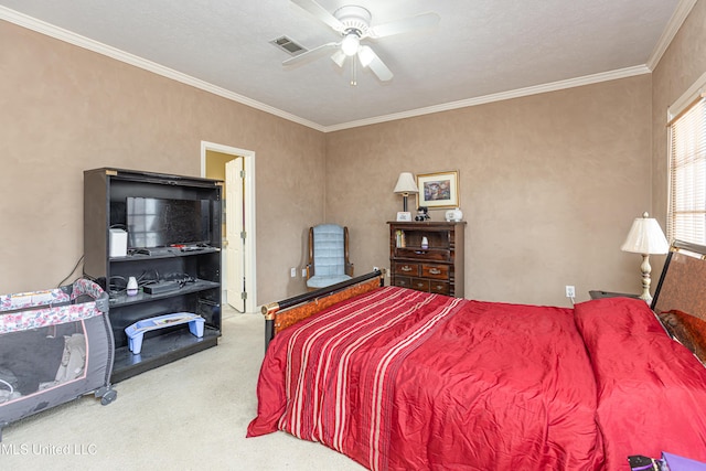 carpeted bedroom with crown molding and ceiling fan